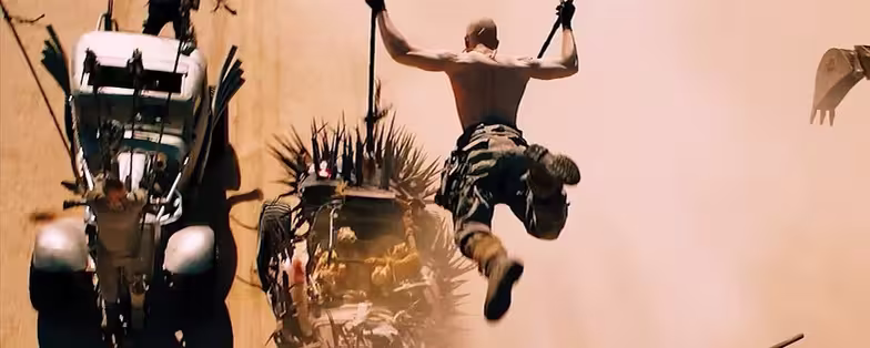 mad-max-fury-road-jumping-to-car-wallpaper